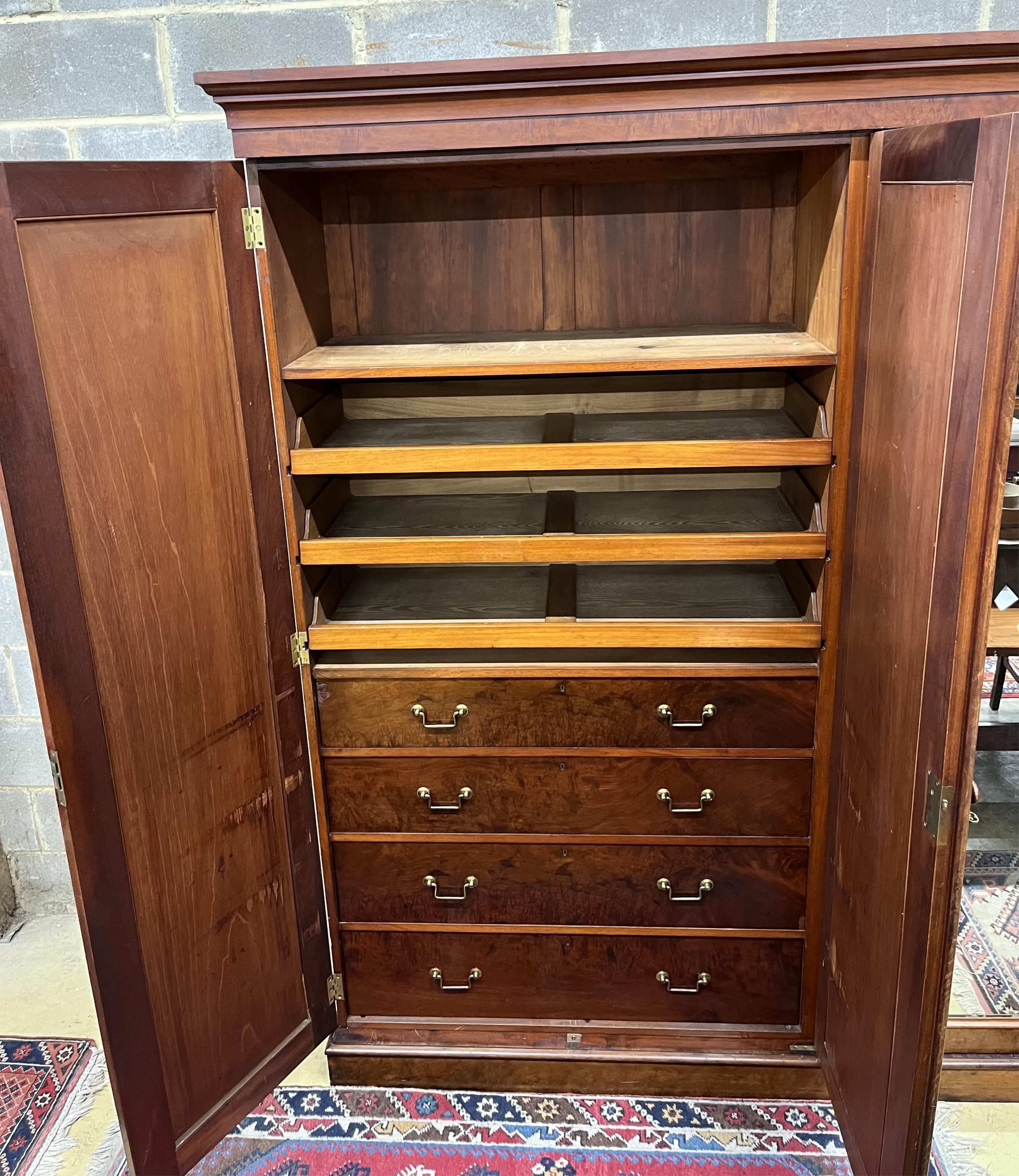 Lamb of Manchester, a Victorian mahogany mirrored compactum wardrobe, width 250cm, depth 58cm, height 231cm. Condition - fair to good